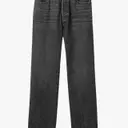 The Dominance of Faded Black Jeans in Contemporary Men's Fashion