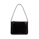 Embracing 90s Minimalism: A Guide to Sleek Handbags