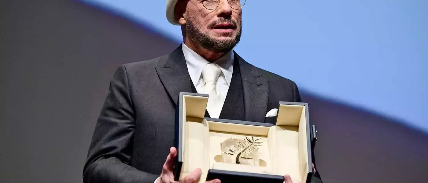 John Travolta's Emotional Acceptance of the Honorary Palme d'Or at Cannes